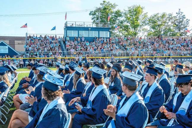 The grandstands are full for Sparta High School’s commencement ceremony. Because of the heat, a livestream also was provided inside the school.