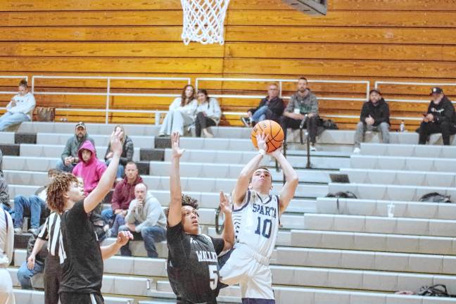 SPB2 Sparta’s Pat Connors handles the ball during a shot. He scored seven points.