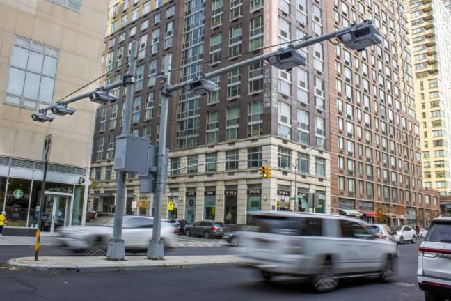 <b>Toll traffic cameras hang above West End Avenue near 61st Street in Manhattan. (File photo by Ted Shaffrey/AP)</b>