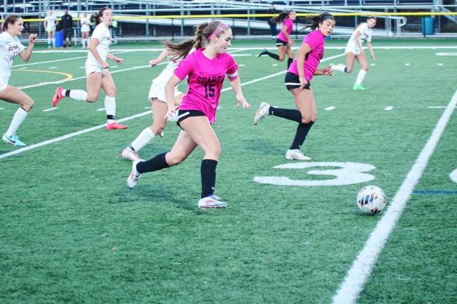 SS1 Sparta's Abigail Connors (15) pursues the ball in the second period of the Hunterdon/Warren/Sussex Tournament semifinal against Hunterdon Centtral on Oct. 16. The Spartans won, 3-0, and Connors scored one goal and made one assist. (Photos by George Leroy Hunter)