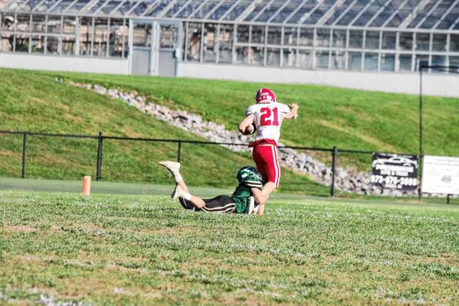 <b>Sussex Tech defender Anthony Padalino tackles Lenape Valley ball carrier Kevin Giusti and stops him just short of the goal line in the fourth quarter. (Photo by George Leroy Hunter)</b>