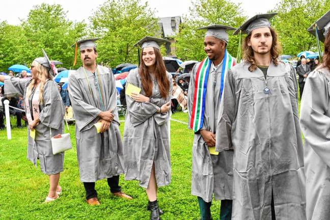 Graduates line up to receive their diplomas.