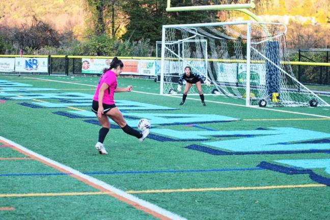 SS2 Sparta's Uma Kowalski kicks the ball toward the goal in the second period. Hunterdon Central's goalie Emily Culton stands ready to defend. Kowalski missed the shot.