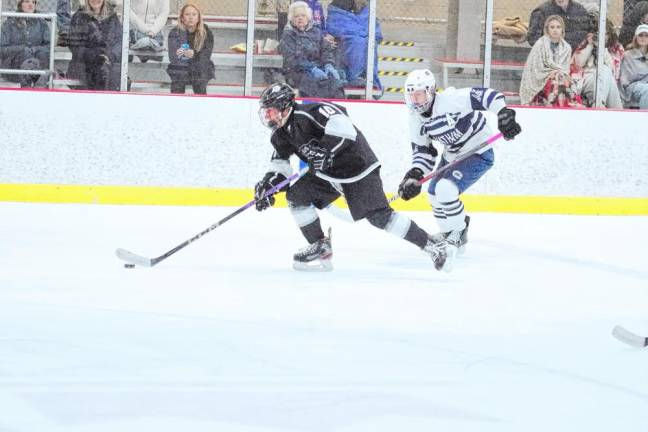 The Kinnelon/Jefferson/Sparta tri-op squad’s Michael Pandiscia steers the puck during the game against Chatham on Dec. 27. KJS United won, 6-0. (Photos by (George Leroy Hunter)