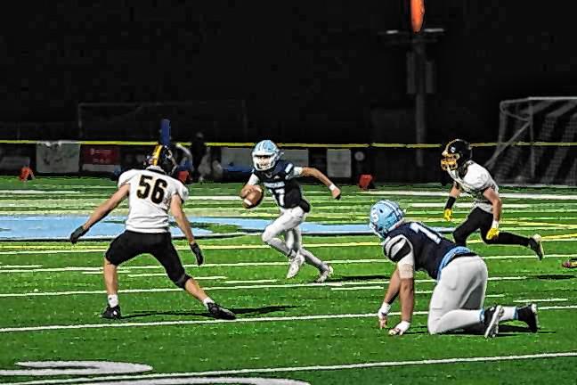 Sparta quarterback Shane Hoover on the run in the game last fall against West Milford. (File photo by George Leroy Hunter)