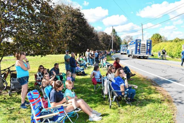 Residents watch the parade.