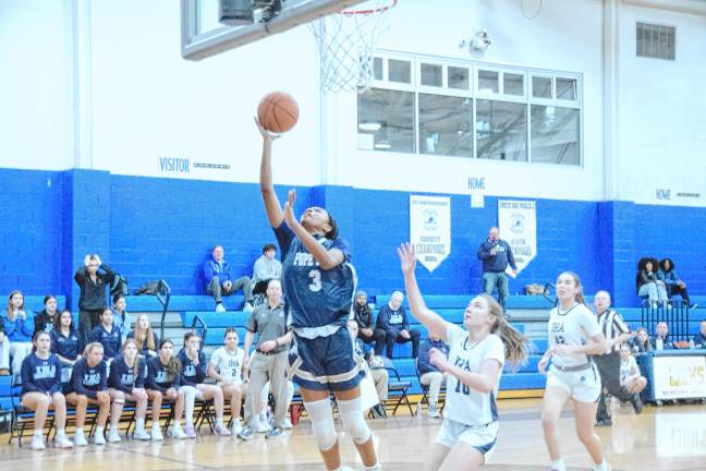 Pope John's Mia Washington takes the ball toward the hoop in the game against Immaculate Heart Academy on March 6. The Lions won, 45-43, in the semifinal round of the NJSIAA North Jersey, Non-Public A Tournament but lost in the final round to top-seeded Morris Catholic, 66-34. (Photos by George Leroy Hunter)