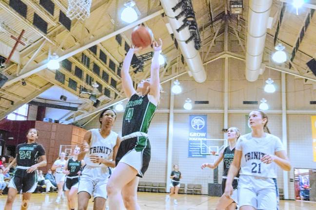 VR3 Veritas Christian's Halle Williamson (4) in the midst of a shot. She scored 16 points. (Photo by George Leroy Hunter)