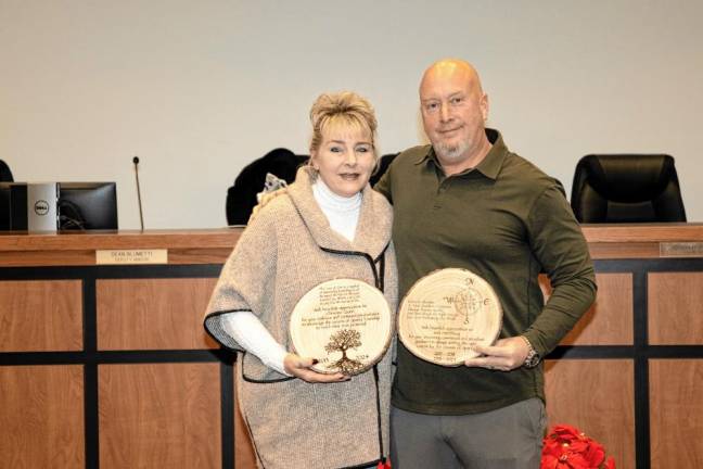 STC1 Township Council members Christine Quinn and Josh Hertzberg are honored for their service during the Dec. 10 meeting. (Photos by Dave Smith)