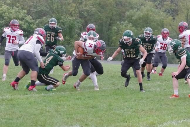 High Point ball carrier Mason Mericle forces his way forward in the first half of the game against Sussex Tech on Saturday, Sept. 23.