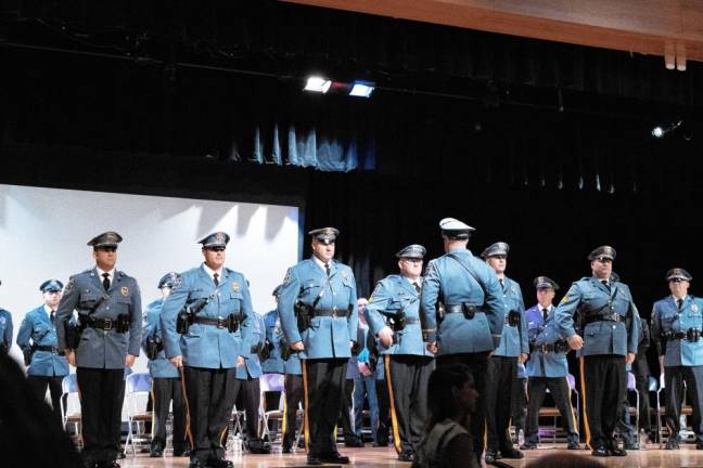 Police Chief Jeffrey McCarrick speaks to the six officers being promoted.