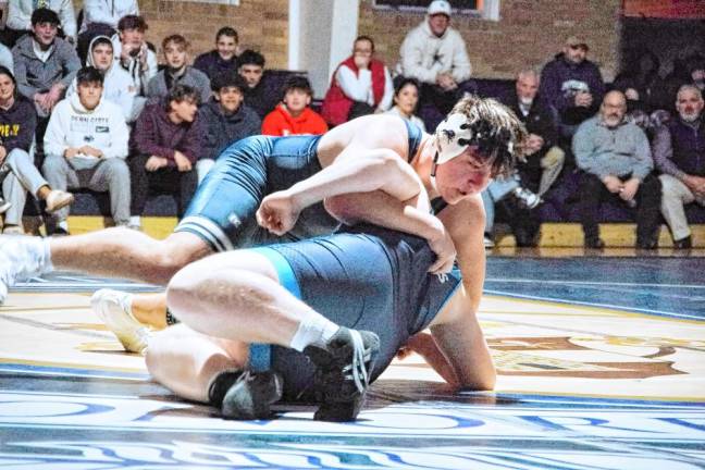 Pope John's Shawn Baumann is on top of Sparta's Michael Pirrello in the 285-pound match. Baumann pinned Pirrello to earn the win.