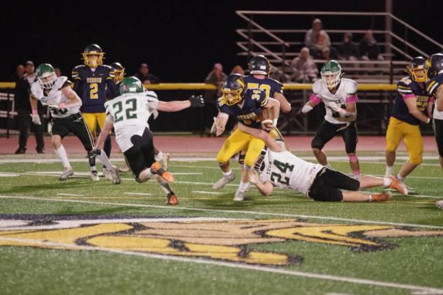 Vernon ball carrier Logan Pych is caught by a Sussex Tech defender in their game Friday, Oct. 20. Pych ran for 211 yards and scored three touchdowns. Vernon won, 35-16. (Photos by George Leroy Hunter)