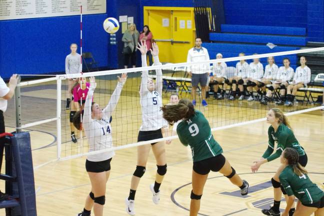 Montville's Reese Henderson bats the ball towards the Pope John side of the net. Henderson contributed two aces, five kills and nine digs.