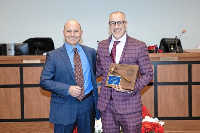 STC2 Mayor Neill Clark, right, with a plaque presented by Deputy Mayor Dean Blumetti.