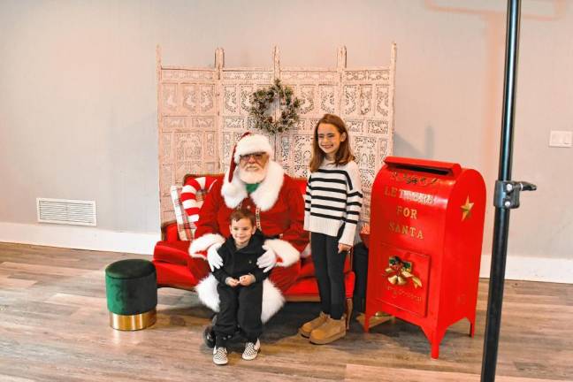 Nova and Noah Rosequist of Wantage pose with Santa at Frankie’s Christmas Spectacular on Dec. 15 in Sparta.