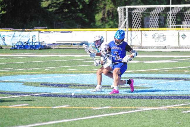 SL2 Sparta's Adam Teixeira and Thomas Kachala of West Morris jostle each other while pursuing the ball.