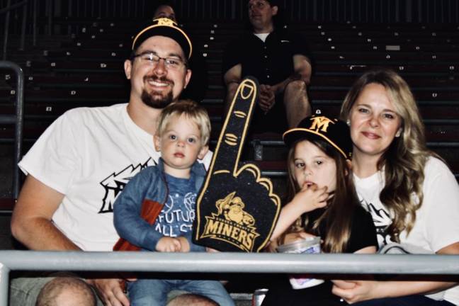 The Casey family of Fredon watches the game.