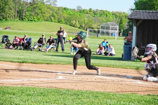 Sussex Tech batter Christina Ferry connects with the ball during a bunt. She scored a run and is credited with one RBI.