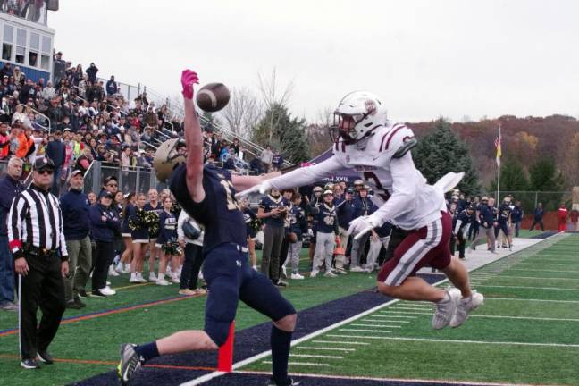 In the third quarter, Pope John wide receiver Joseph Rozynski makes a valiant effort to catch the ball inside the end zone in front of Don Bosco Prep defensive back Conor Cosgrove (3). Rozynski was not able to catch it. Pope John lost the first-round game in the Non-Public, Group A tournament, 28-17, at home Saturday, Nov. 4. (Photos by George Leroy Hunter)