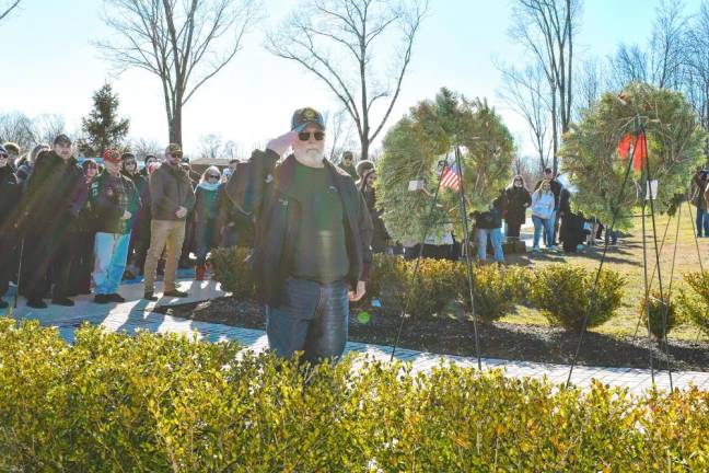 A man salutes after placing a wreath during the ceremony at the Northern New Jersey Veterans Memorial Cemetery in Sparta. (Photo by Maria Kovic)