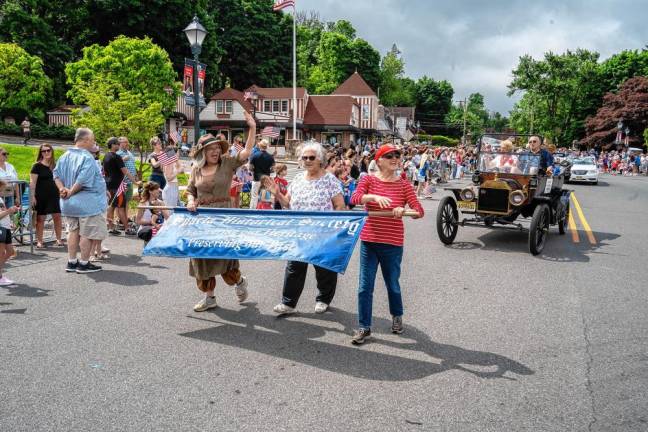 Members of the Sparta Historical Society march in the parade.