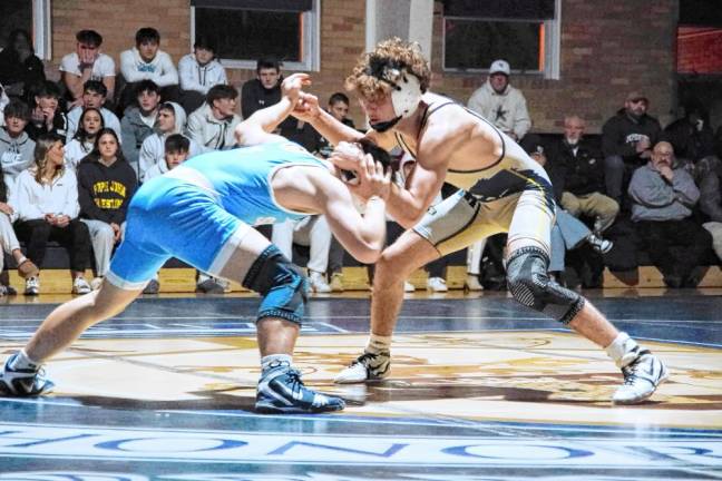 Sparta's Chase Brodersen, left, and Pope John's Dalton Weber battle in the 132-pound match. Weber won the match by 'technical fall' (22-4).