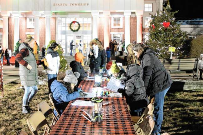 Children write letters to Santa before the tree lighting.