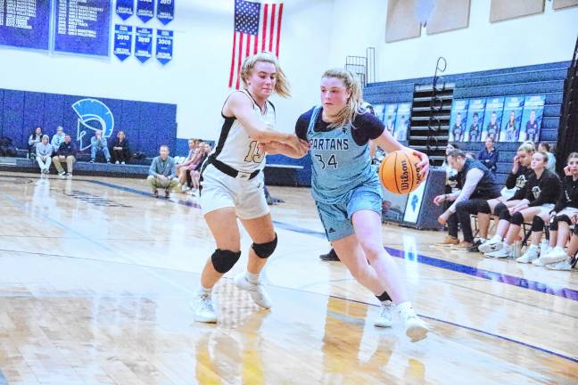 Sparta's Molly Chapman dribbles the ball past a River Dell defender. She scored nine points.