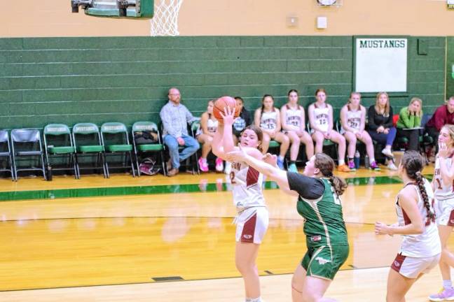 Newton's Jordyn Young grabs the ball during a rebound. She scored 13 points and grabbed four rebounds.