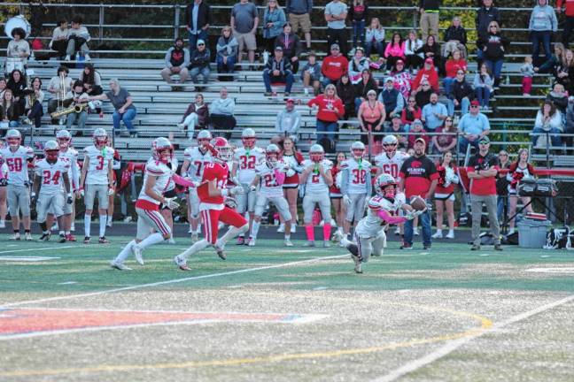 <b>High Point defensive back Brendan Lehman (21) catches the ball for an interception during the final seconds of the game at Lenape Valley on Friday, Oct. 11. The Wildcats won, 21-14. (Photos by George Leroy Hunter)</b>