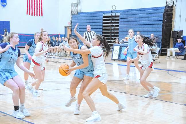 Sparta's Kayla Barreau handles the ball under tight coverage. She scored three points and grabbed five rebounds.