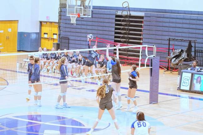 Sparta's Arielle Gomez (18) leaps and strikes the ball. She made five kills.