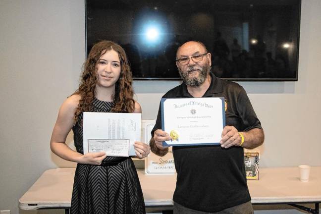 Lorayne Gulbrandsen receives a $3,000 scholarship. At right is Peter Litchfield, commander of VFW Post #7248 in Sparta.