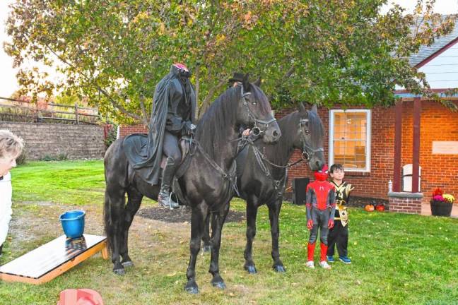 Two boys pose with the Headless Horseman.