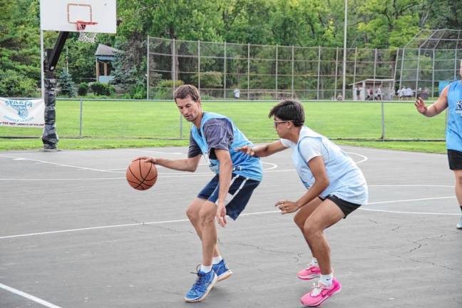 A Team Smalley dribbler is covered by a Team Reilly defender.