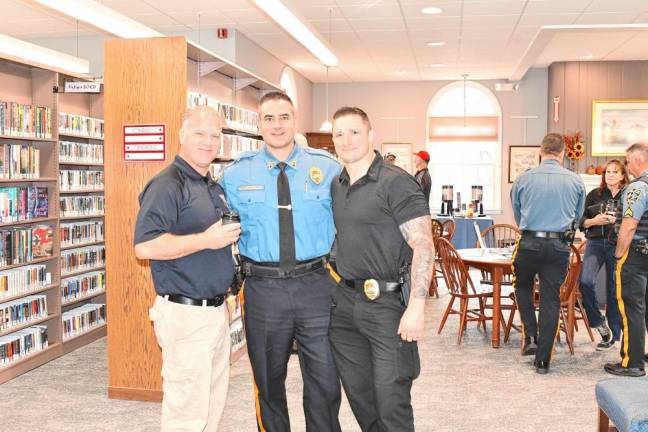 Sparta Police Officers Richard Smith, Joe Antonello and Matt Pletcher pose at the Coffee with a Cop event.