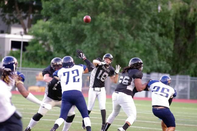 Central Pennsylvania Piranhas quarterback Dom Hobdy (18) launches the ball in the second quarter.