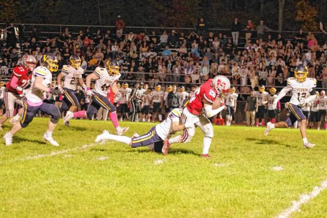 <b>High Point ball carrier Dylan Masters is tackled by Vernon defender Sam Simone in the second quarter. Masters made a touchdown catch in the second quarter. (Photo by George Leroy Hunter)</b>