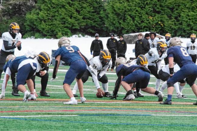 The St. John Vianney offense face the Pope John defense in the first half.