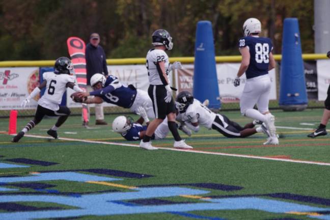 Sussex Skylanders quarterback Jaiden Mead-Cooper reaches the ball across the goal line to score the first touchdown against Hudson Valley Community College of Troy, N.Y. Mead-Cooper scored a passing touchdown and a rushing touchdown in the game played Sunday, Oct. 15 at Sparta High School. (Photo by George Leroy Hunter)