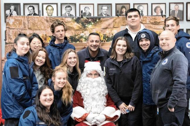 Sparta Ambulance Squad members pose with Santa.