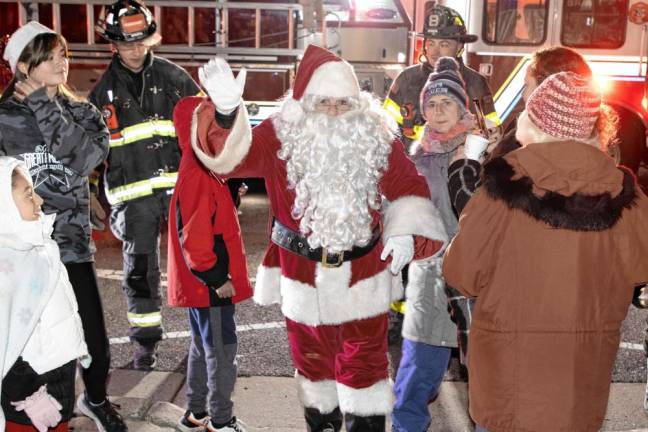 Santa arrives on a firetruck for the annual Christmas Tree Lighting on Friday, Dec. 6 at the Sparta municipal building. (Photo by Dave Smith)