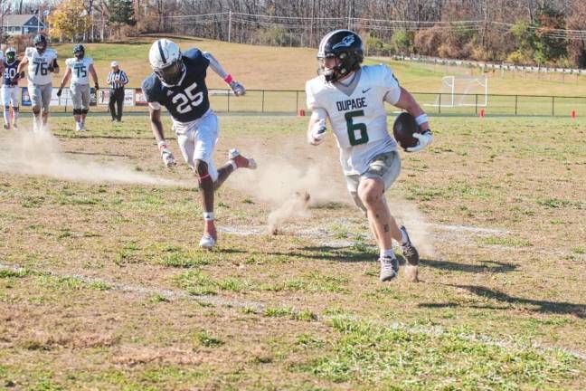 A Sussex County defender chases a DuPage ball carrier.