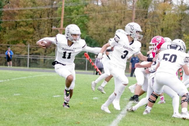 Wallkill Valley ball carrier Jaden McNeil follows his blockers. McNeil scored one touchdown.