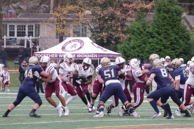 Lamont Lester (9) of Don Bosco carries the ball.