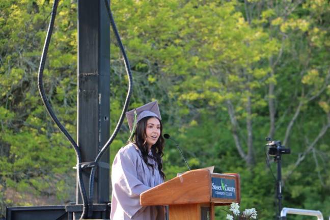 The student speaker, Madison Portugal, addresses her classmates.