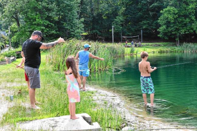 Children take part in the annual fishing derby Saturday, July 20 at Alpine Beach on Lake Mohawk.