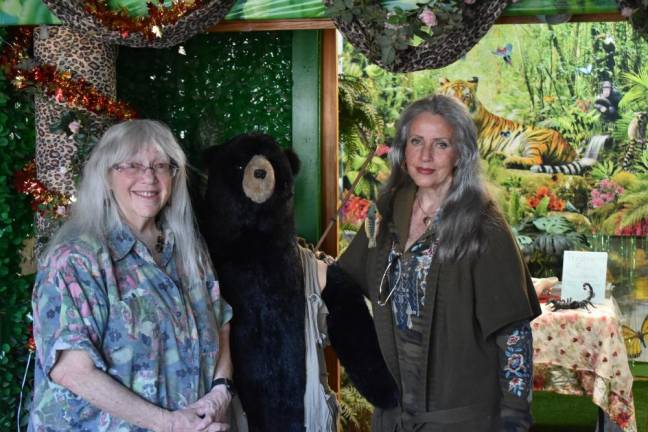 Karen Lang (left) a retired reading teacher who volunteers at Noah’s Park, and Diana McGowan, co-owner of Noah’s Park, in a room used for birthday parties