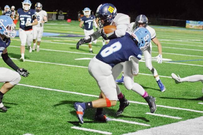 Sparta defensive back Noah Faria tackles Jefferson wide receiver Michael Studnick in the first half. Faria made 2 tackles and accomplished 1 interception.